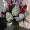Hot pink roses, lavander stock, hydrangeas and some grenery 