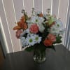Orange and white flowers on a vase 