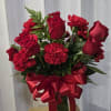 This beautiful arrangement features a classic and romantic combination of red roses