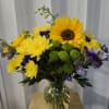 This vibrant bouquet is cheerful and full of color, perfect for brightening