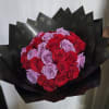 This elegant bouquet features a striking mix of red and lavender roses