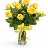 Golden Sunshine Roses
Bright yellow roses arranged in a clear glass vase, accented