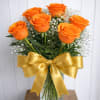 Orange roses with a bow