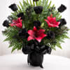 A striking arrangement of elegant black roses paired with vibrant pink lilies