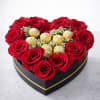 A stunning heart-shaped arrangement featuring premium red roses paired with Ferrero Rocher