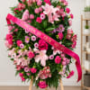 graceful standing sympathy spray designed to honor a cherished life. This elegant