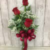 Three roses in a vase