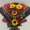 Bouquet of red roses and yellow sunflowers wrapped in black and burgundy paper