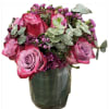 Dozen roses, eucalyptus and pink wax flower in a short cylinder vase