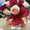 greenery with a dozen red and a dozen light pink or peach
