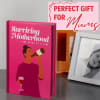 Pink gift book and framed photo beside a bottle of wine