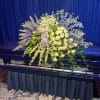 Roses, blue delphiniums, hydrangeas and more. A play on blue to left