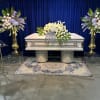 Roses, hydrangeas, blue delphiniums and more. Gathered to honor the life and
