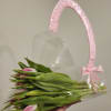 Pink tulips in a clear gift bag with a pink ribbon handle