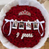 Round bouquet of red roses with a tiara, photo strip, and white ribbon