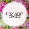 Pink and white floral arrangement with a Designer's Choice label