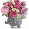 Pink and white flower arrangement in a gray elephant planter with a "Hello Baby!" sign