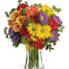 Colorful mixed bouquet in a clear glass vase