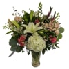 Bouquet of lilies, hydrangea, and pink flowers in a glass vase