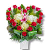 Bouquet of red roses, white hydrangeas, and pink lilies in a white vase