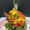 The "flower horn" is a representation of the cornucopia, a symbol of