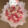 Bouquet of pink and cream roses with a Hello Kitty plush topper