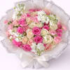 Bouquet of pink and cream roses with white flowers wrapped in white paper
