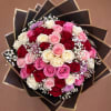 Bouquet of pink, red, and white roses with baby's breath