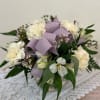 White floral bouquet with lavender ribbon and greenery