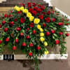 Large casket spray of red and yellow roses