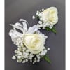 Two white rose boutonnieres with baby's breath and ribbon