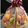 Fruit basket wrapped in tulle with a burgundy bow