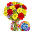 Colorful bouquet of daisies and carnations in a glass vase with a birthday balloon