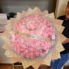Large bouquet of pink roses with a tiara and ribbon