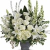 A serene cluster of white roses, Asiatic lilies, and pale hydrangeas creates