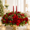 Red rose centerpiece with candles in a gold bowl