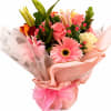 Pink and peach mixed bouquet with roses, lilies, and a gerbera daisy in pink wrap
