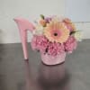 Pink floral arrangement in a pink high-heel shoe container