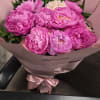 Lush, romantic pink peonies take center stage in this birthday bouquet, their