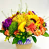 Bright mixed flower arrangement in a decorative vase