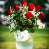 A passionate arrangement of lush red roses, artfully displayed to capture the