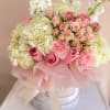 A delicate and elegant floral arrangement designed to express love, sweetness, and