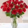 Enjoy traditional red roses in a clear glass vase 
With the touch