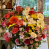 Large mixed flower basket with roses, gerbera daisies, and carnations