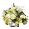 White lilies and pale roses in a square glass vase