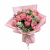 Pink rose bouquet wrapped in pink paper with a ribbon