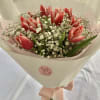 10 Tulips with Baby's Breath as fillers

