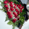 Layed 25 roses with baby'sbreath and greenary.
With nice wrapping.