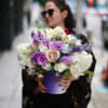 Bouquet of pastel flowers in a purple vase