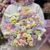 Large pastel bouquet of pink roses and lavender flowers